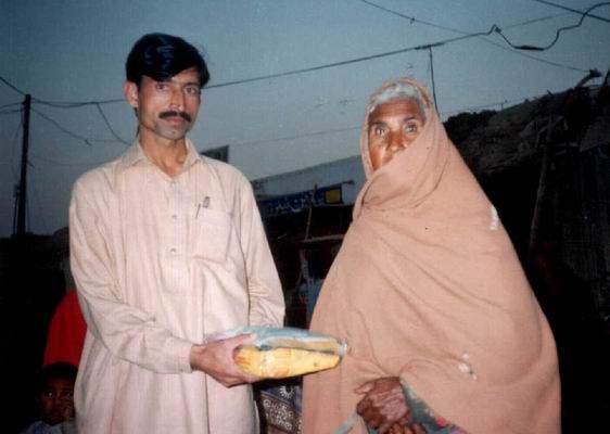 Member distributes food packet  