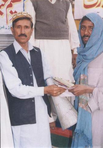Mian Amin distributing  