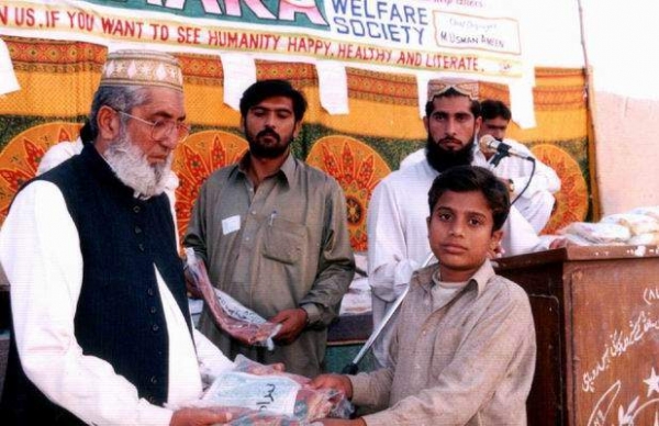 Mr Feroze Khan distributes books  