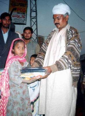 Mr Jamil Sheikh distributes clothes  