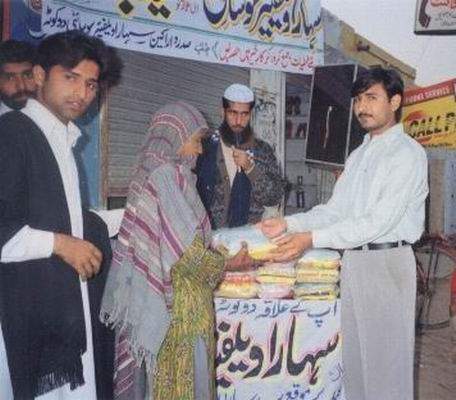 Mr Khalid distributing Food Packet  